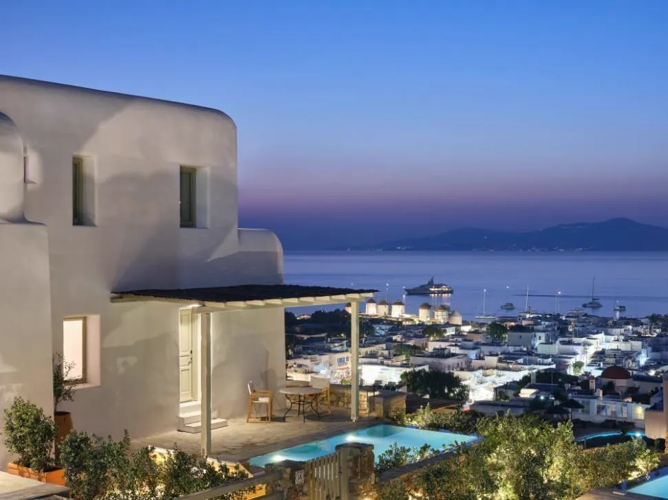 Belvedere Mykonos at dusk, town and harbor below