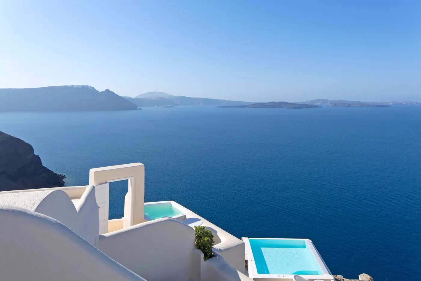 Canaves Oia, white architecture and plunge pools over the caldera