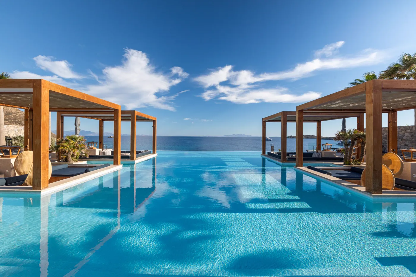 Santa Marina infinity pool over Ornos Bay