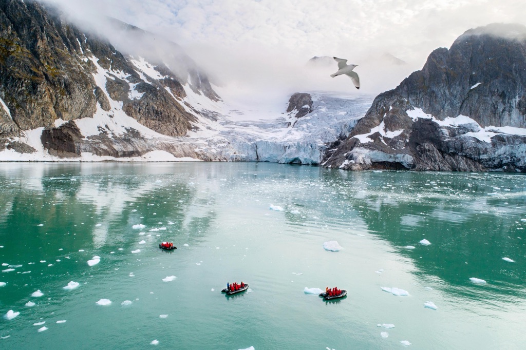 Silversea Expeditions zodiacs in an Arctic fjord
