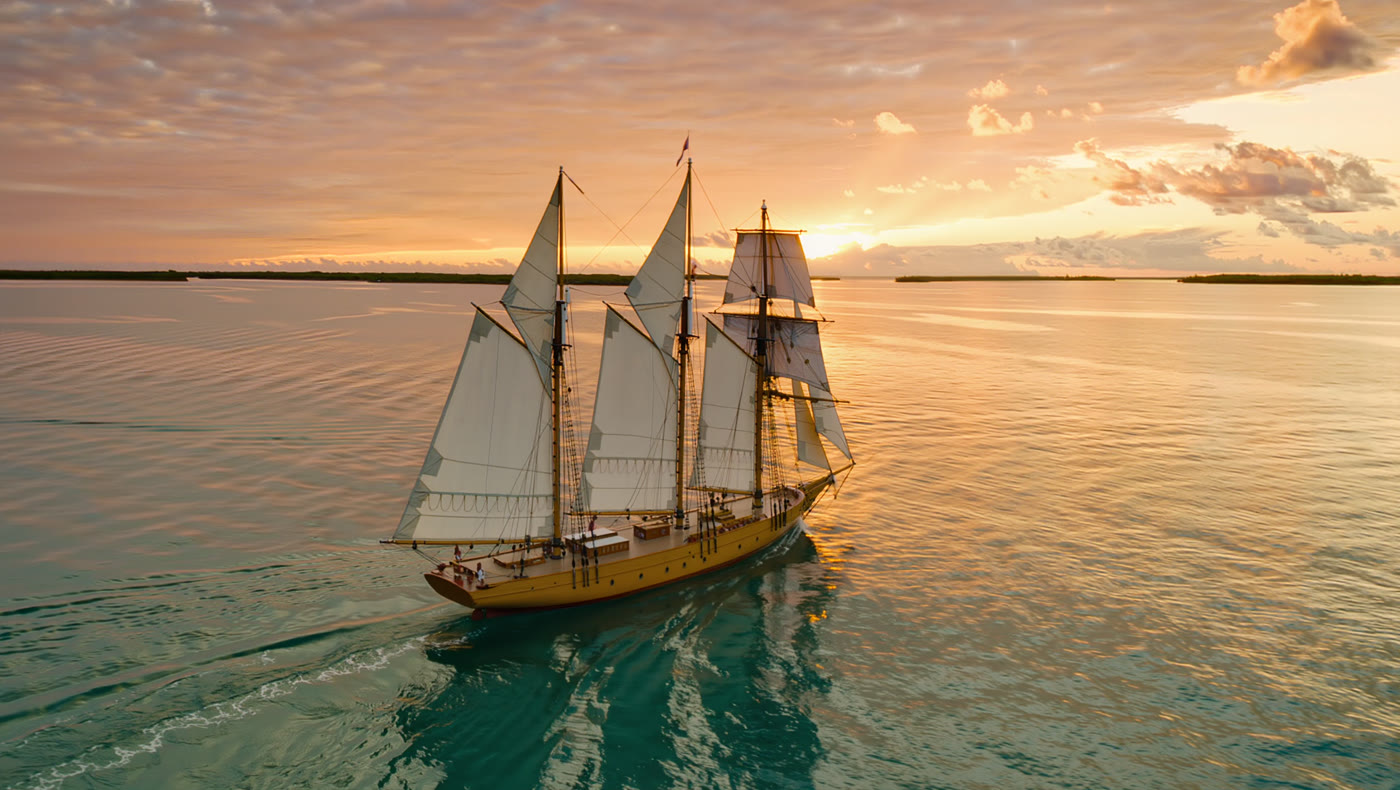 A classic schooner sailing at sunset off Key West